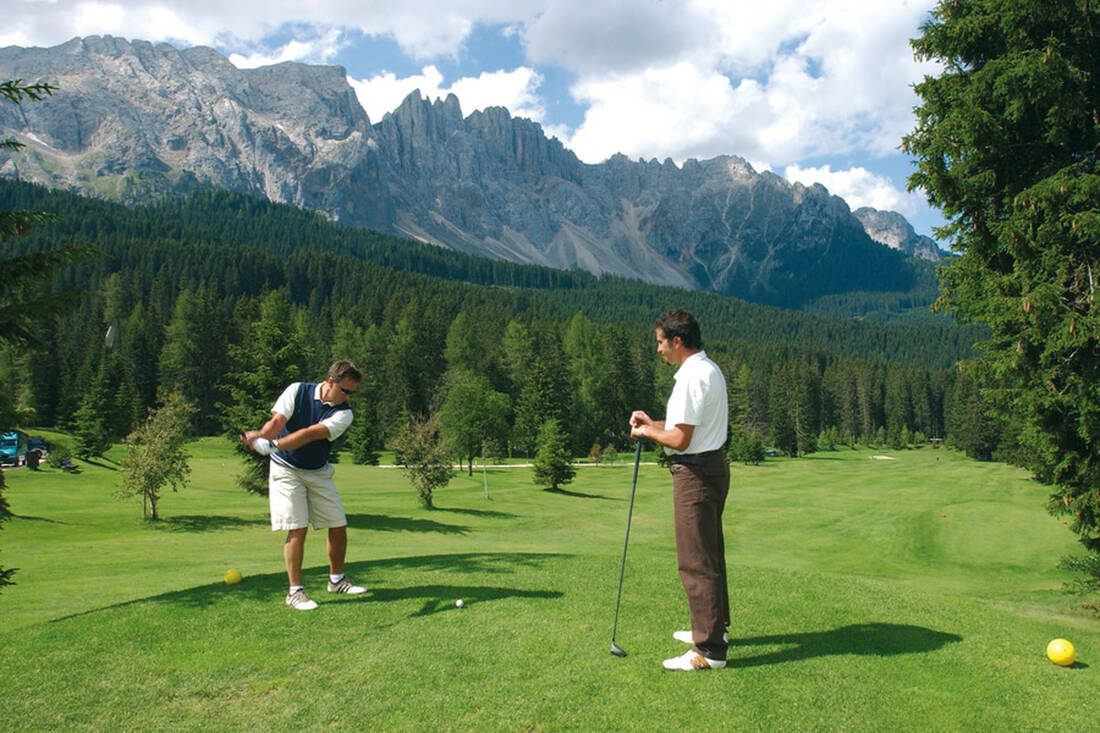 Golfing at the Carezza Pass with Latemar