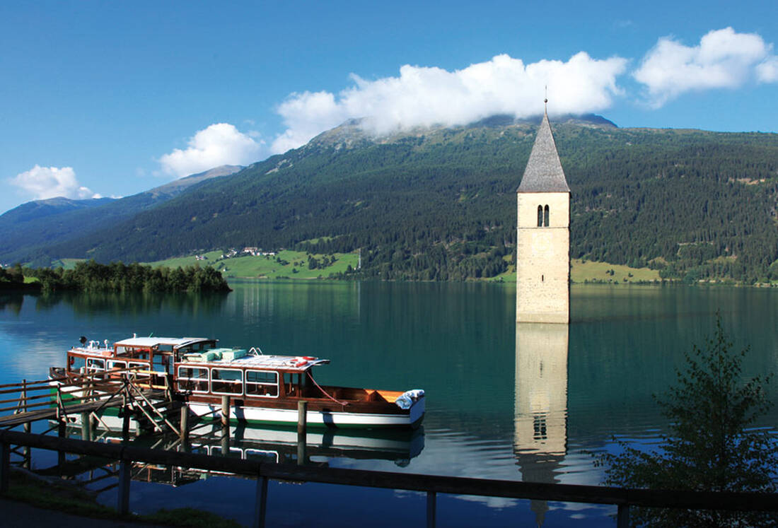 Curon Tower in Lake Reschen with Boat