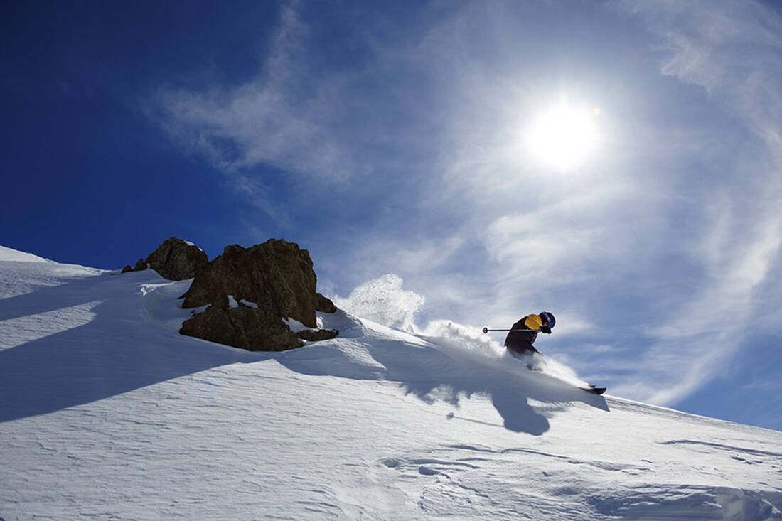 Skiers on the mountain ridge